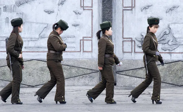 Female North Korean soldiers patrol along the banks of Yalu River, near the North Korean town of Sinuiju, opposite the Chinese border city of Dandong, April 11, 2013. South Korea and the United States were on high alert for a North Korean missile launch on Thursday as the hermit kingdom turned its attention to celebrating its ruling Kim dynasty and appeared to tone down rhetoric of impending war. (Photo by Jacky Chen/Reuters)