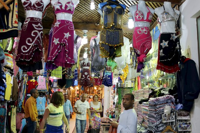 Tourists walk at a bazaar in Naama bay area in the Red Sea resort of Sharm el-Sheikh, November 7, 2015. (Photo by Asmaa Waguih/Reuters)