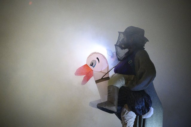 An anti-I.C.E. protester in an inflatable costume stands in a cloud of tear gas near the U.S. Immigration and Customs Enforcement building on October 18, 2025 in Portland, Oregon. Organizers expect millions to participate in cities and towns across the nation for the second “No Kings” protest to denounce the Trump administration. (Photo by Mathieu Lewis-Rolland/Getty Images)