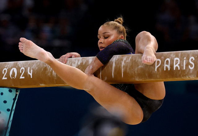 Brazil's Flavia Saraiva falls down as she competes in the balance beam event of the artistic gymnastics women's qualification during the Paris 2024 Olympic Games at the Bercy Arena in Paris, on July 28, 2024. (Photo by Hannah Mckay/Reuters)