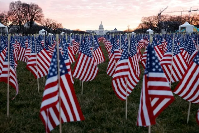 Thousands of U.S. flags are seen at the National Mall, to represent the people who are unable to travel to Washington for the inauguration, in Washington, U.S., January 18, 2021. (Photo by Carlos Barria/Reuters)