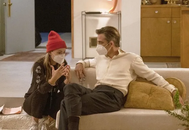 This image released by Warner Bros. Entertainment shows actor-director Olivia Wilde, left, with Chris Pine on the set of “Don't Worry Darling”. (Photo by Merrick Morton/Warner Bros. Entertainment via AP Photo)