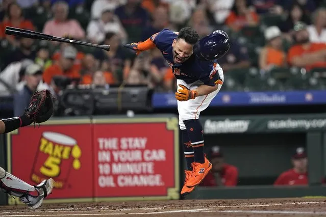 Houston Astros' Jose Altuve reacts after being hit by a pitch thrown by Washington Nationals starting pitcher Josiah Gray during the first inning of a baseball game Wednesday, June 14, 2023, in Houston. (Photo by David J. Phillip/AP Photo)