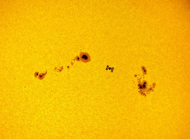 The International Space Station (ISS) was captured between two massive sunspots – taken from Madrid. (Photo by Dani Caxete/Fernández Méndez/Astronomy Photographer of the Year 2018)
