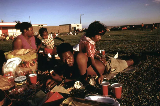 A family enjoys a picnic at 12th Street Beach on Lake Michigan, August 1973. (Photo by John H. White/NARA via The Atlantic)