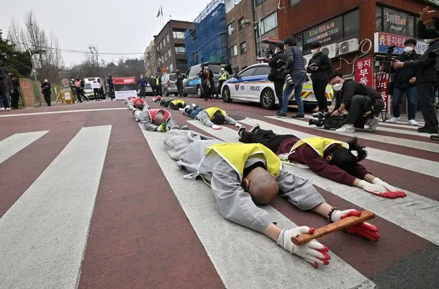 South Korean Buddhist monks and Myanmar nationals living in South Korea march and bow during a protest against Myanmar's military coup in front of the Myanmar embassy in Seoul on March 12, 2021. (Photo by Jung Yeon-je/AFP Photo)