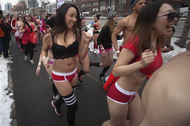People take part in the Cupid's Undie Run in the Manhattan borough of New York February 7, 2015. The run, held to raise funds to combat children's tumors, sees runners in their underwear partying and running along the West Side Highway. (Photo by Carlo Allegri/Reuters)