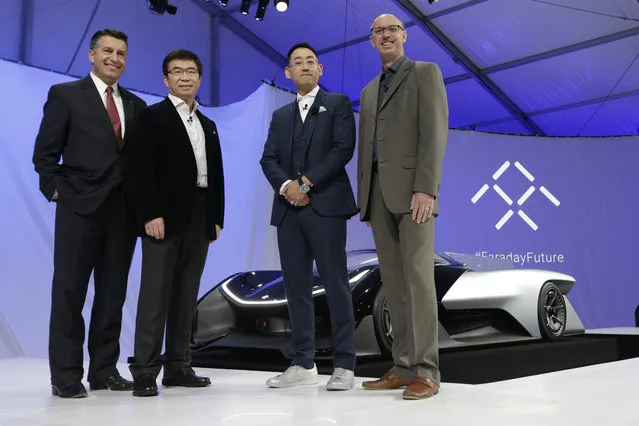 Nevada Gov. Brian Sandoval, left, poses for a photo in front of the FFZero1 by Faraday Future, alongside members of the Faraday Future team at CES Unveiled, a media preview event for CES International  Monday, January 4, 2016, in Las Vegas. From right are Nick Sampson, product developer, Richard Kim, head of global design,  Ding Lei, and letv co-founder. (Photo by Gregory Bull/AP Photo)