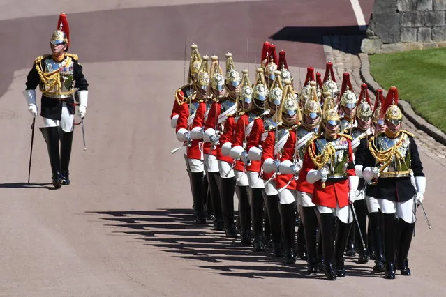 Members of the military during the procession ahead of Britain Prince Philip's funeral at Windsor Castle, Windsor, England, Saturday April 17, 2021. Prince Philip died April 9 at the age of 99 after 73 years of marriage to Britain's Queen Elizabeth II. (Photo by Jeremy Selwyn/Pool via AP Photo)