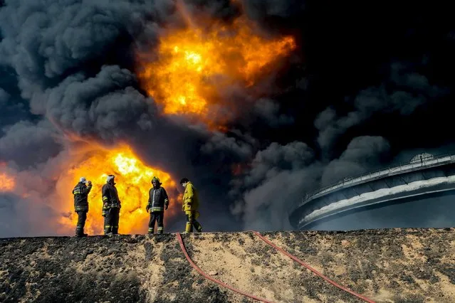 Firefighters try to put out the fire in an oil tank in the port of Es Sider, in Ras Lanuf, Libya January 6, 2016. (Photo by Reuters/Stringer)
