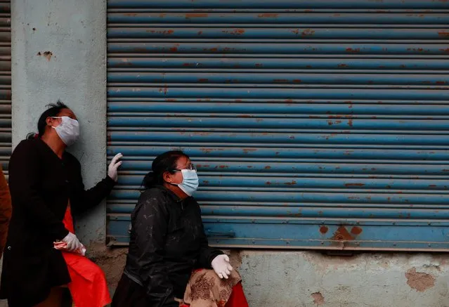 Family members of a person who died from coronavirus disease (COVID-19) mourn outside the hospital while Nepal is overwhelmed by a COVID-19 surge, as India's outbreak spreads across South Asia, in Kathmandu, Nepal on May 5, 2021. (Photo by Navesh Chitrakar/Reuters)