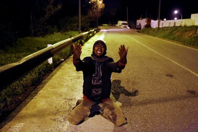 An African migrant reacts on a road after crossing the border fence between Morocco and Spain's north African enclave of Ceuta, December 9, 2016. (Photo by M. Martin/Reuters)