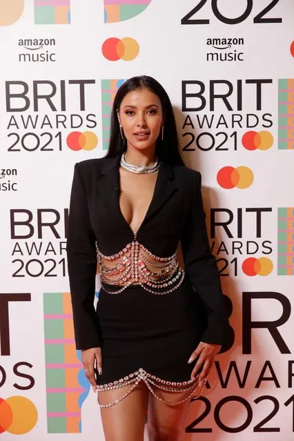 In a handout picture released by the Brit Awards television and radio presenter Maya Jama poses on the red carpet on arrival for the BRIT Awards 2021 in London on May 11, 2021. (Photo by John Marshall/Handout via Reuters)
