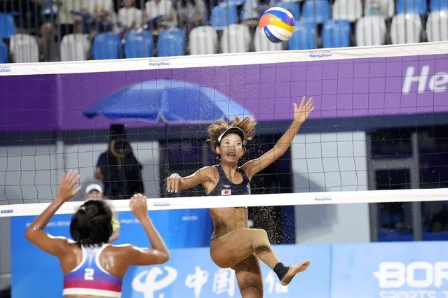 Japan's Miki Ishii, right, who paired with Sayaka Mizoe, not in picture, plays against Floremel Rodriguez and Genesa Jane Eslapor of Philippines during Women's beach volleyball quarterfinal match at the 19th Asian Games in Ningbo, China, Monday, September 25, 2023. (Photo by Eugene Hoshiko/AP Photo)