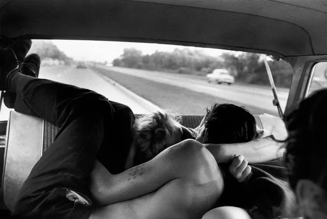 Backseat of a car, from the series, ‘Brooklyn Gang’ New York City, 1959, by Bruce Davidson. “You’re looking at Lefty and his girlfriend, members of a Brooklyn gang who referred to themselves as “The Jokers”, on a trip to Bear Mountain State Park. This photograph is not meant to be risque. These were young, teenage kids who had a great deal of spirit, energy and love in lives that were reckless, unstable and oftentimes dangerous. In the words of one: “We didn’t come from dysfunctional families, the whole neighbourhood was dysfunctional”. (Photo by Bruce Davidson/Magnum Photos)