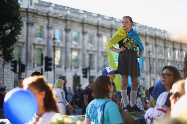 A kid participates in a demonstration against Russia's invasion of Ukraine, during a Ukrainian Independence Day rally outside Downing Street, in London, Britain on August 24, 2022. (Photo by Hannah McKay/Reuters)