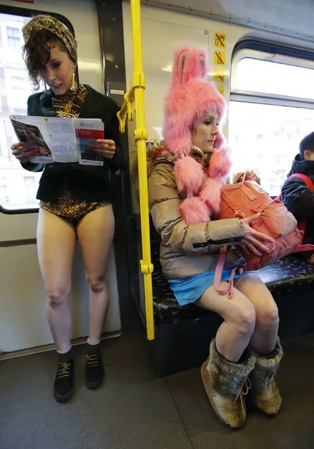 Passengers without their pants use a subway train during the “No Pants Subway Ride”  in Berlin January 12, 2014. (Photo by Fabrizio Bensch/Reuters)