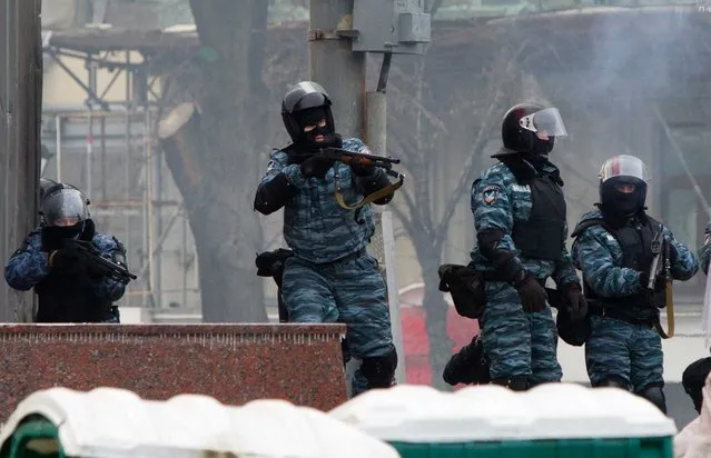Riot policemen during clashes with protesters outside Dynamo stadium in Kiev. (Photo by Andrey Stenin/RIA Novosti)