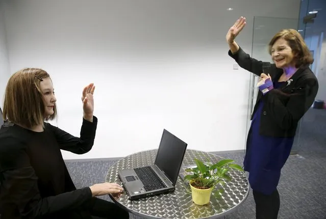 Nanyang Technological University's (NTU) Professor Nadia Thalmann (R) talks to Nadine, a humanoid that she and her team created, during an interview with Reuters at their campus in Singapore March 1, 2016. With her brown hair, soft skin and expressive face, Nadine is a new brand of human-like robot that could one day, scientists hope, be used as a personal assistant or care provider for the elderly. (Photo by Edgar Su/Reuters)
