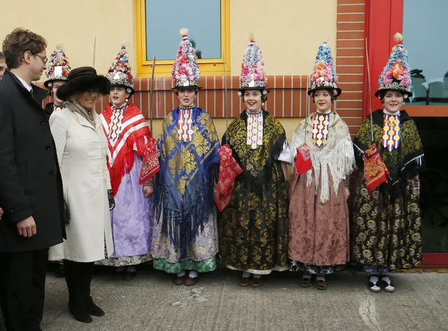 Camilla, the Duchess of Cornwall (2nd L) and Principle of the State Stud Farm Djakovo Nidal Korabi (L) look at girls dressed in traditional clothes, in the State Stud Farm in Djakovo, Croatia, March 15, 2016. (Photo by Antonio Bronic/Reuters)