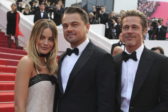 Actors Margot Robbie from left, Leonardo DiCaprio and Brad Pitt poses for photographers upon arrival at the premiere of the film “Once Upon a Time in Hollywood” at the 72nd international film festival, Cannes, southern France, Tuesday, May 21, 2019. (Photo by Petros Giannakouris/AP Photo)