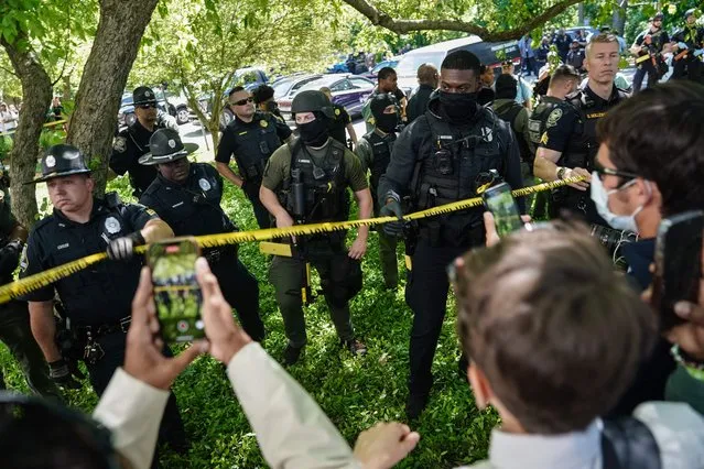 Pro-Palestinian activists confront police officers during a demonstration at Emory University on April 25, 2024, in Atlanta, Georgia. (Photo by Elijah Nouvelage/AFP Photo)