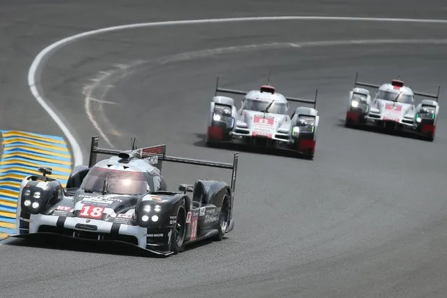 The Porsche 919 Hybrid No18 of the Porsche Team driven by Neel Jani of Switzerland is seen in action during the 83rd 24-hour Le Mans endurance race, in Le Mans, western France, Saturday, June 13, 2015. (AP Photo/David Vincent)