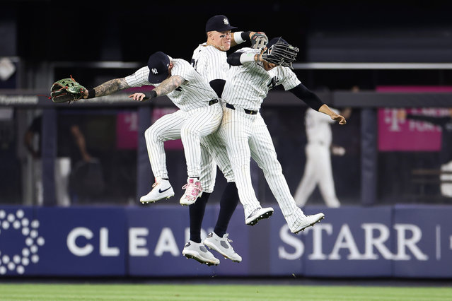 Alex Verdugo #24, Aaron Judge #99, and Juan Soto #22 of the New York Yankees celebrate after a 7-3 win against the Seattle Mariners at Yankee Stadium on May 22, 2024 in the Bronx borough of New York City. (Photo by Luke Hales/Getty Images)