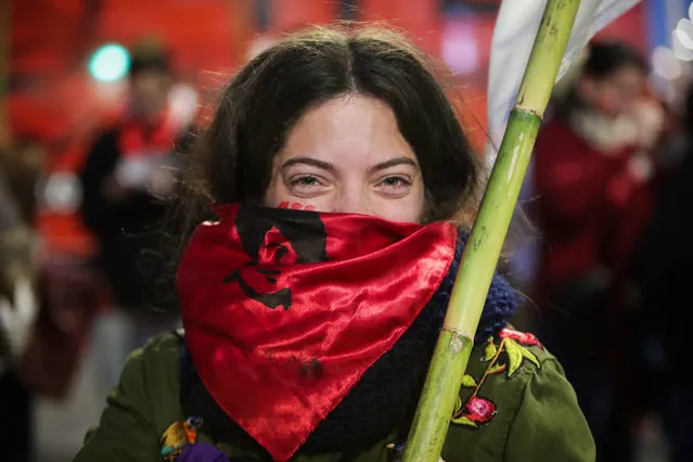 A woman takes part in a march in Montevideo, Uruguay, 14 August 2019. Each 14 August, people in Montevideo participate in the March of the Student Martyrs, in honor of the students killed or kidnapped during the last Uruguayan dictatorship (1973-1985). The chosen date coincides with the death date of of student activist Liber Arce in 1968. (Photo by Raul Martinez/EPA/EFE)