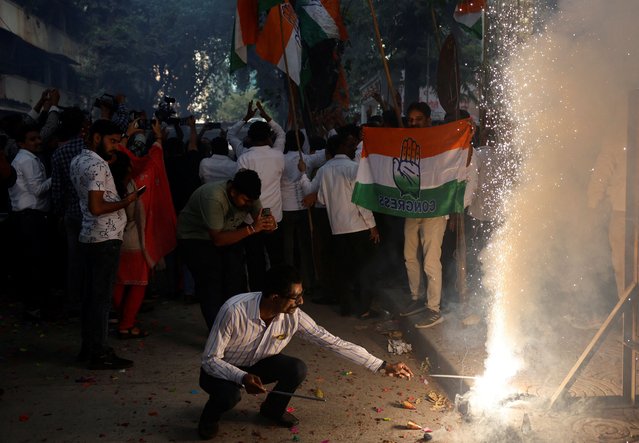 An Indian National Congress (INC) supporter lights firecrackers after election results in Mumbai, India, on June 4, 2024. (Photo by Francis Mascarenhas/Reuters)