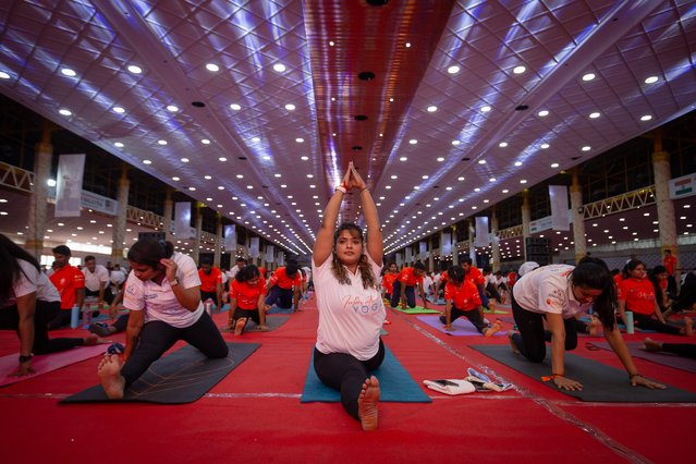 Yoga practitioners attend an event to mark the International Day of Yoga on June 21, 2024 in Bengaluru, India. Yoga practitioners in Bengaluru officially attempted to set new Guinness World Records for seven different asanas or yoga postures. (Photo by Abhishek Chinnappa/Getty Images)