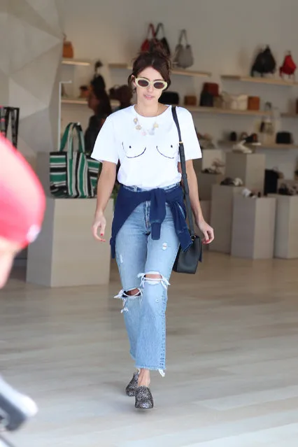 Emma Roberts wears a boob shirt while shopping at Rebecca Minkoff ahead of Coachella in Los Angeles, USA on April 13, 2017. (Photo by LA Photo Lab/Splash News and Pictures)