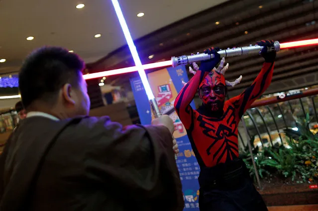 Fans dressed as the characters from “Star Wars” react during Star Wars Day in Taipei, Taiwan on May 4, 2017. (Photo by Tyrone Siu/Reuters)