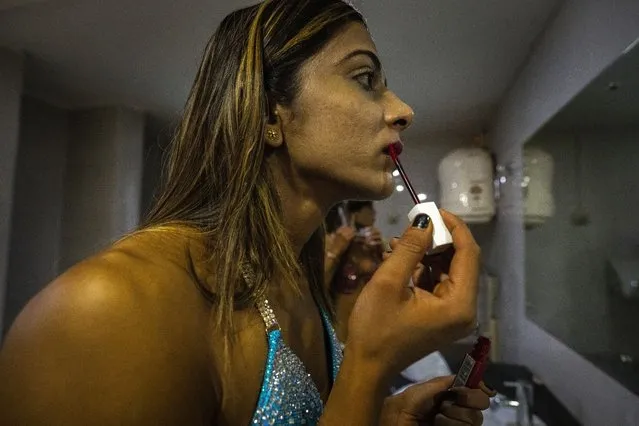 Female body builders prepare backstage to participate in the first national Miss Saraighat Body Building Championship in Gauhati, northeastern Assam state, India, Saturday, April 2, 2022. (Photo by Anupam Nath/AP Photo)