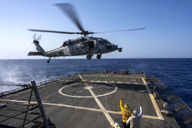 An HSC-7 helicopter lands on the Arleigh Burke-class guided missile destroyer USS Laboon in the Red Sea, Wednesday on June 12, 2024. (Photo by Bernat Armangue/AP Photo)