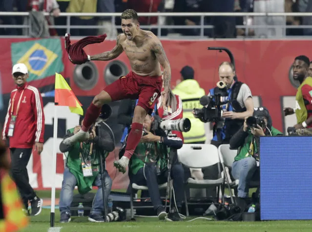 Liverpool's Roberto Firmino celebrates after scoring his sides first goal during the Club World Cup final soccer match between Liverpool and Flamengo at Khalifa International Stadium in Doha, Qatar, Saturday, December 21, 2019. (Photo by Hassan Ammar/AP Photo)