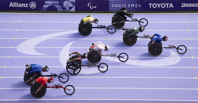 Thailand's Chaiwat Rattana leads in the Para Athletics Men's 100m - T34 Final at the Stade de France at the Paris 2024 Paralympic Games, Paris, France, Monday September 2, 2024. (Photo by Bob Martin/IOC via AP Photo)