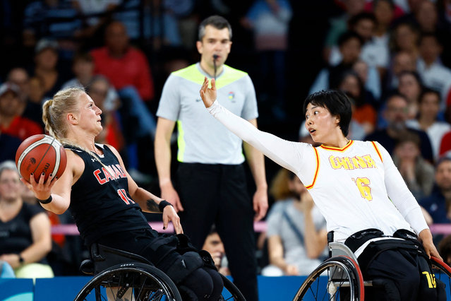 Kady Dandeneau of Canada in action with Dai Jiameng of China in the women’s wheelchair basketball bronze medal match at Bercy Arena in Paris, France on September 8, 2024. (Photo by Carlos García Rawlins/Reuters)