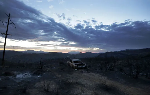 A car burned in the Rocky Fire is shown near Lower Lake, Calif., Tuesday, August 4, 2015. (Photo by Jeff Chiu/AP Photo)