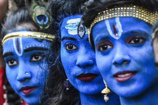 Students dressed up as Hindu gods Lord Krishna and Lord Shiva participate in a cultural event in their school in Mumbai on August 21, 2019. (Photo by Indranil Mukherjee/AFP Photo)