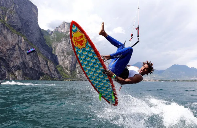 A kite surfer takes to the air while surfing on Garda Lake in northern Italy, June 18, 2016. (Photo by Stefano Rellandini/Reuters)