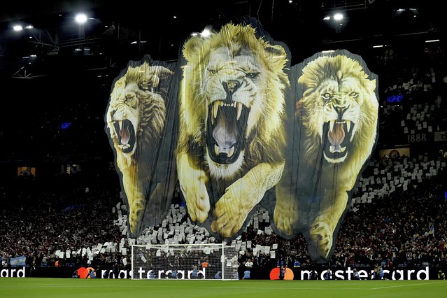 Fans unveil a giant banner prior to the Champions League opening phase soccer match between Aston Villa and Bologna at the Villa Park in Birmingham, England, Tuesday, October 22, 2024. (Photo by Rui Vieira/AP Photo)