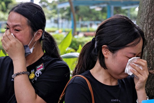 Fans cry after the funeral of Hong Kong-born, American singer and songwriter Coco Lee, in Hong Kong, China on August 1, 2023. (Photo by Tyrone Siu/Reuters)