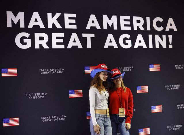 Supporters of Donald Trump pose for a picture at the site of the election night rally for him at the Palm Beach County Convention Center, in West Palm Beach, Florida on November 5, 2024. (Photo by Brendan Mcdermid/Reuters)
