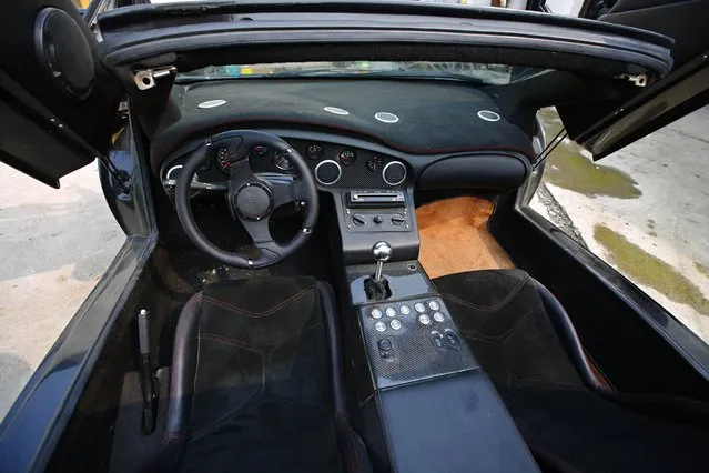 The interior of a handmade replica of Lamborghini Diablo is pictured outside a garage rented by Wang Yu and Li Lintao on the outskirts of Beijing, August 21, 2014. (Photo by Petar Kujundzic/Reuters)