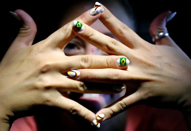 German Olympic freestyle swimmer Sarah Koehler sports her Olympic nail polish on board a German airline Lufthansa flight to Rio de Janeiro, Brazil, early morning, July 24, 2016. (Photo by Kai Pfaffenbach/Reuters)