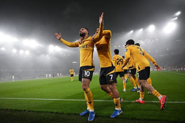 Matheus Cunha of Wolverhampton Wanderers celebrates scoring his team's first goal with teammates during the Premier League match between Wolverhampton Wanderers FC and Manchester United FC at Molineux on December 26, 2024 in Wolverhampton, England. (Photo by Shaun Botterill/Getty Images)