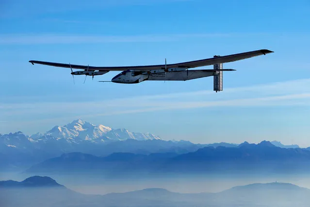 German test pilot Markus Scherdel steers the solar-powered Solar Impulse 2 aircraft with the Mont-Blanc in background during a training flight at its base in Payerne, September 27, 2014. (Photo by Denis Balibouse/Reuters)