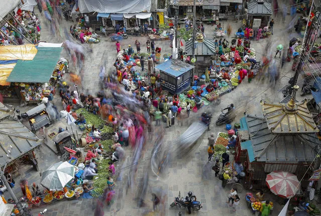 A picture made available on 11 July and taken with slow exposure shows an overview of Nepalese is shopping in very old Ason market in Kathmandu, Nepal. 03 July 2016. The recent report published on 01 January 2016, the population of Nepal was estimated to be 28 679 524 people. This is an increase of 1.18 % (335 312 people) compared to 2015. The capital Kathmandu are becoming more populous city as people from around the country start settling in  Kathmandu, due to all types of human facilities, Migration, globalization, government plan and policies, and political condition are the main factors .  So Now Nepal is listed on the one of the world’s 50 populous countries. (Photo by Narendra Shrestha/EPA)