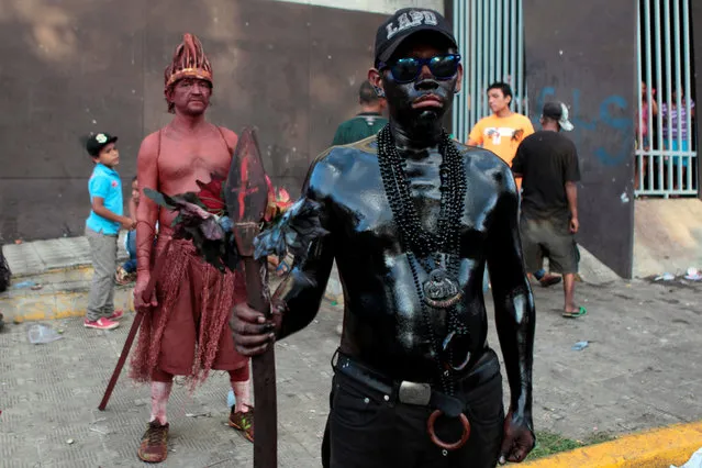 A man covered in motor oil takes part in the celebrations honoring the patron saint of Managua, Santo Domingo de Guzman, in Managua, Nicaragua August 9, 2016. (Photo by Oswaldo Rivas/Reuters)